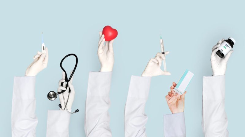 Doctors hands holding medical care objects Doctors hands holding medical care objects